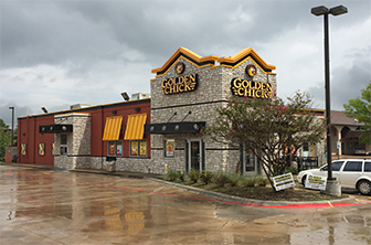Golden Chick storefront.  Your local Golden Chick fast food restaurant in Greenville, Texas